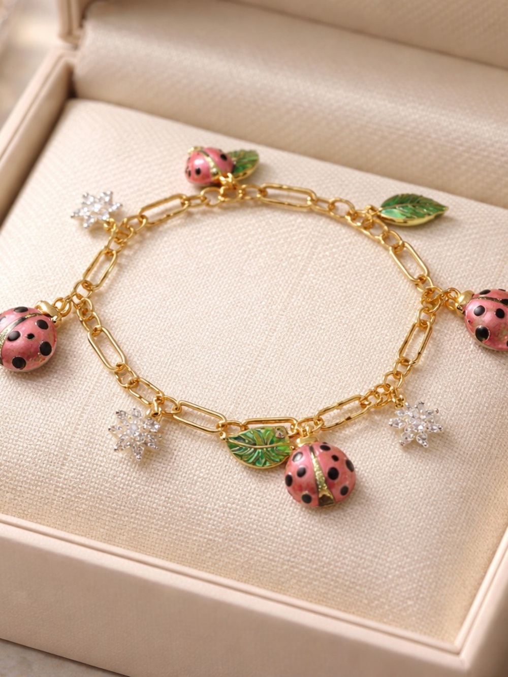 kate spade Gold-Plated Bracelet with Pink Ladybug and Green Leaf Charms